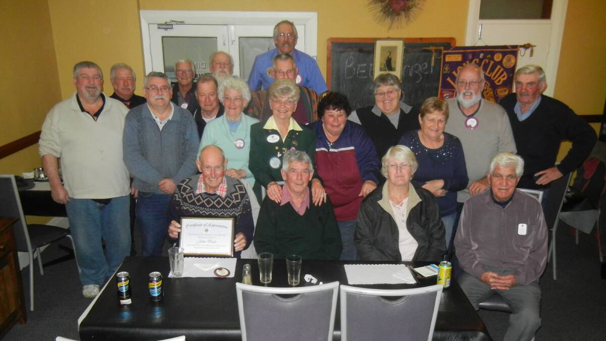 VDG Anne Jones, PDG Peter Perry amd Zone Chairman Terry Caroll with members of the Canowindra Lions Club.
