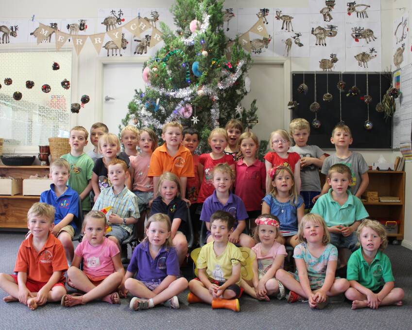 Pre-schoolers gathered in front of their Christmas tree last week. The children put on a special Christmas performance for their parents.