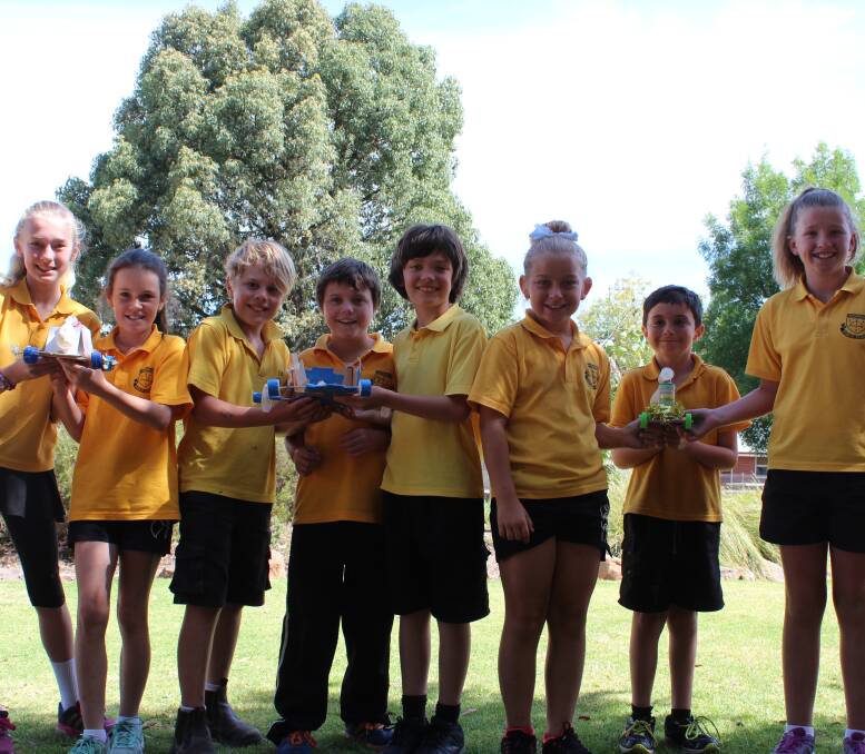From left - Amelie Kerr, Skyla Dunkley, Raph Cuddy, Garret Towns, Peter Jones, Emily Thomas, Marshall Woods and Eden Hawker show off their handmade cars. Absent - Mahalah Read. 