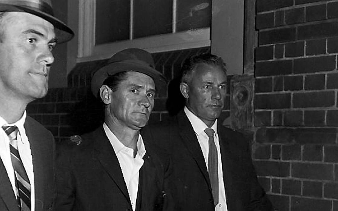 50 years: Melbourne prison escapee Ronald Ryan is taken to police headquarters in Sydney after his recapture, 5 January 1966. Photo: W. Croser