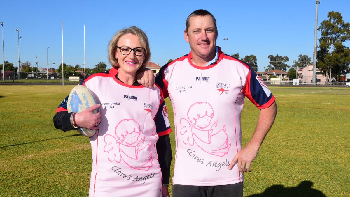 REASON TO PLAY: Jane Diffey of Clare's Angels with Roos coach Dean Matthews and the special jerseys to be worn Saturday. Photo: BELINDA SOOLE