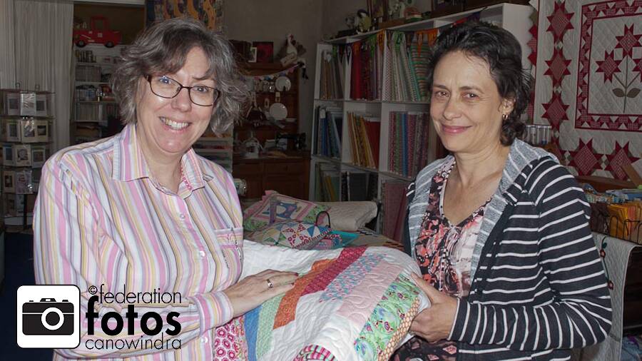 Marie Miller from Cowra, who won the quilt of the weekend award, pictured with organiser Debbie Guihot (left). Photo by Federation Fotos.