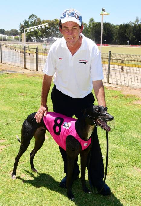 Canowindra greyhound trainer Paul Britt pictured with Lucky Thirteen. Photo by Belinda Soole.