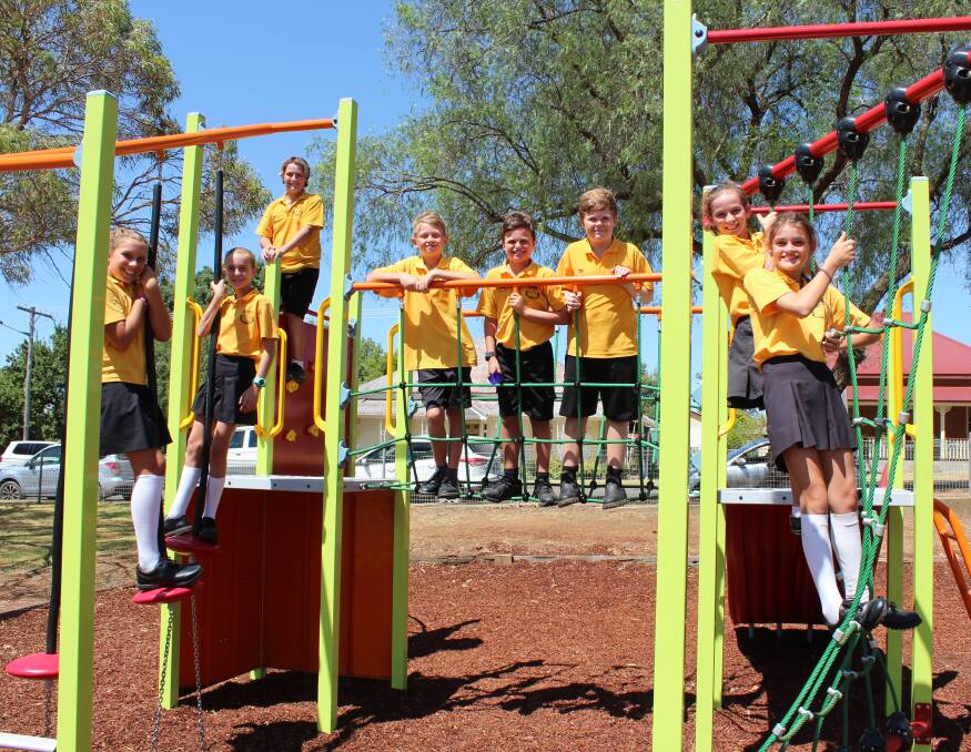 The Canowindra Public School captains and prefects trying out the playground equipment.