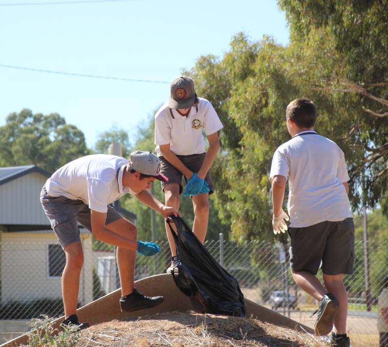 Canowindra High School students cleaning the skate park at the Canowindra sports ground.