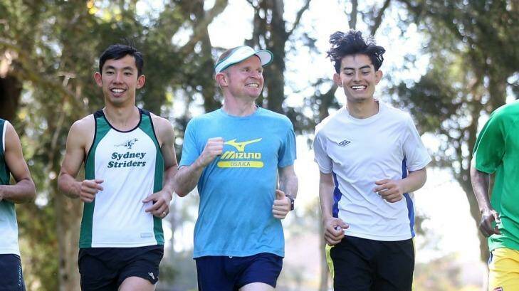 Teachers Keith Hong and David Criniti with the students as they train for their first half-marathon. Photo: Anthony Johnson