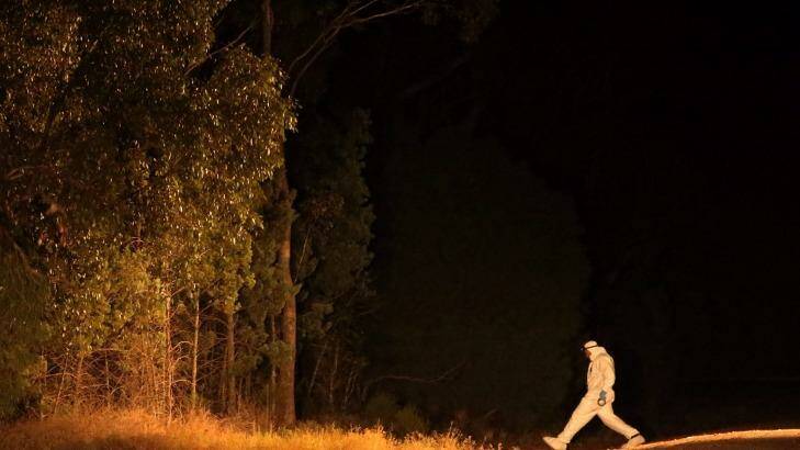A forensic officer walks into Cocoparra National Park, where Stephanie Scott's body was found. Photo: Kate Geraghty