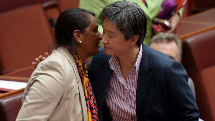 Senator Nova Peris is embraced by opposition leader in the Senate Penny Wong following her statement.  Photo: Andrew Meares