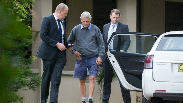 Detectives arrest Bill Spedding at his Bonny Hills home on Wednesday. Photo: Edwina Pickles