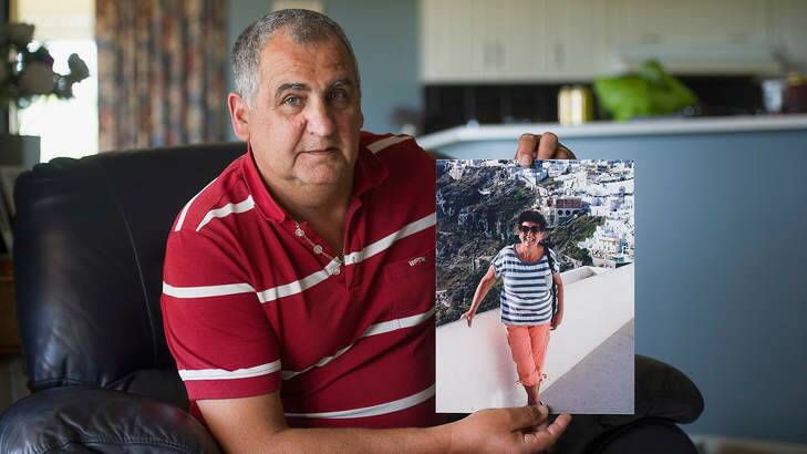 Hans Sidelik holding a photo of his sister Helena, who was killed when flight MH17 was shot down over the Ukraine. Photo: David Mariuz