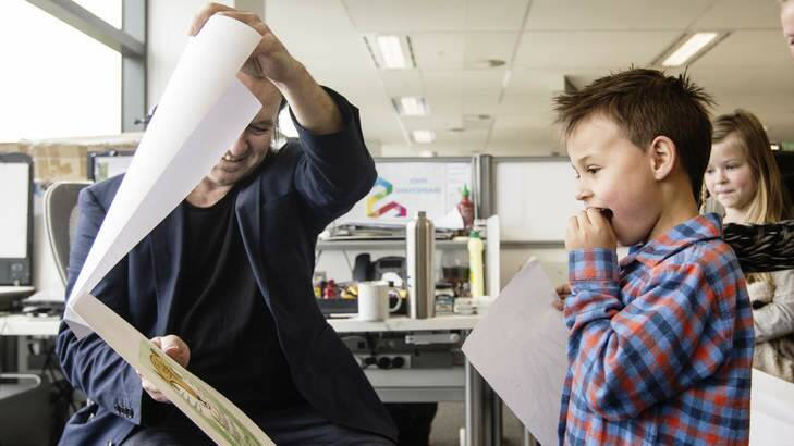 John Shakespeare showing Lachlan Gordon the finished version of his drawing. Photo: Nic Walker