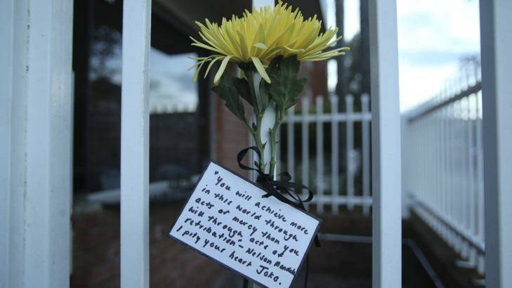 Flowers tied to the gate of the Indonesian consulate in Maroubra, with a note stating: "You will achieve more in this world through acts of mercy than you will through acts of retribution - Nelson Mandela. I pity your heart Joko." Photo: Kate Geraghty