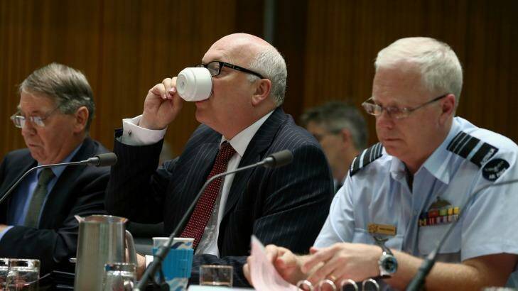 Department of Defence secretary Dennis Richardson, Attorney-General George Brandis and Chief of the Defence Force, Air Chief Marshal Mark Binskin at the Senate hearing. Photo: Alex Ellinghausen