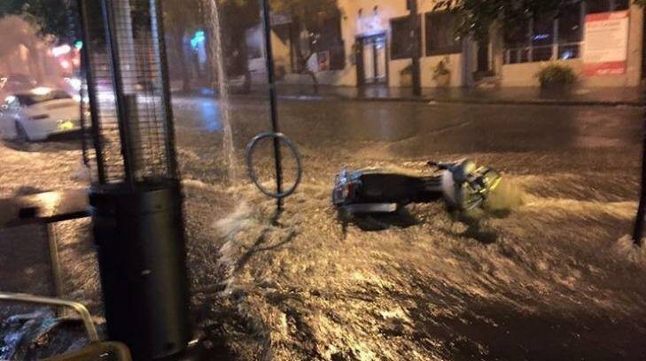 Outside the Lord Roberts Hotel, corner Stanley St
and Riley St Darlinghurst as the storm passed over the city.  Photo: Warren Lee