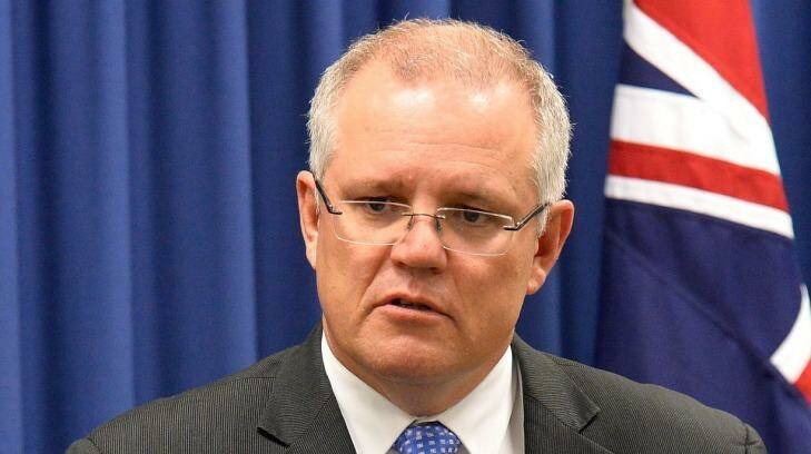 Federal Treasurer Scott Morrison says he was only following orders from then leader Tony Abbott when the Coalition blocked the Gillard government's Malaysian 'people-swap' solution. Photo: Bradley Kanaris