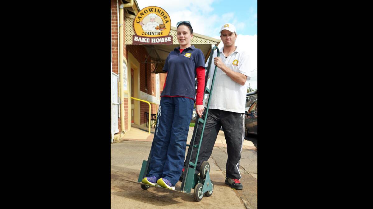 While a wheelbarrow will replace the trolley on the day, Ashley Bayliss and Anthony Kemper from Canowindra Country Bakehouse start practising for the newest addition to the Canowindra Show- the Canowindra Country Bakehouse Farmer's Challenge.