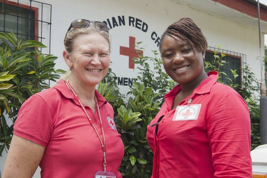 Nurse Libby Bowell with a colleague in Liberia. Photo: Supplied