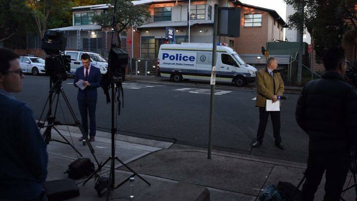 The media gather outside Merrylands Police Station on Friday morning. Photo: Nick Moir