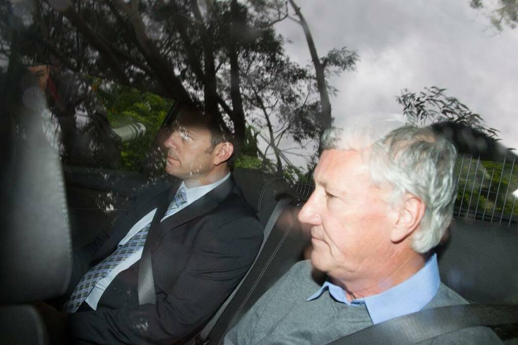 Bill Spedding is taken from his Bonny Hills home by detectives on Wednesday.  Photo: Edwina Pickles