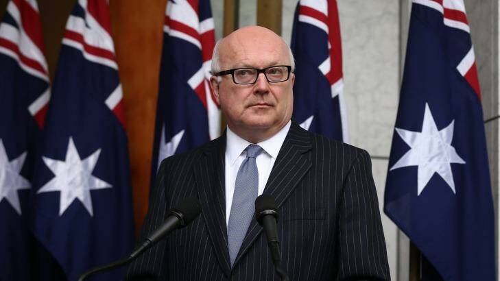 Attorney-General George Brandis has asked the Family Law Council to consider ways to transfer family disputes between family and state and territory courts. Photo: Alex Ellinghausen