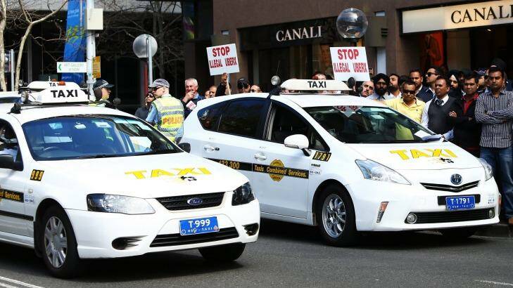 Taxi drivers protest against Uber at the NSW State Parliament this month.  Photo: Daniel Munoz