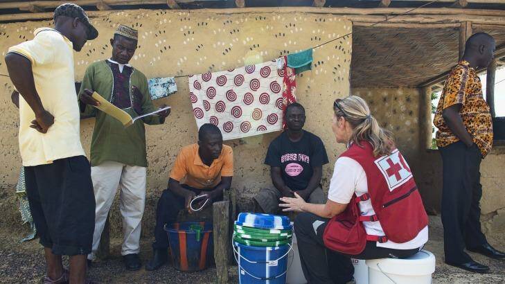 Red Cross volunteer nurse Libby Bowell talks to villagers in Liberia. Photo: Supplied