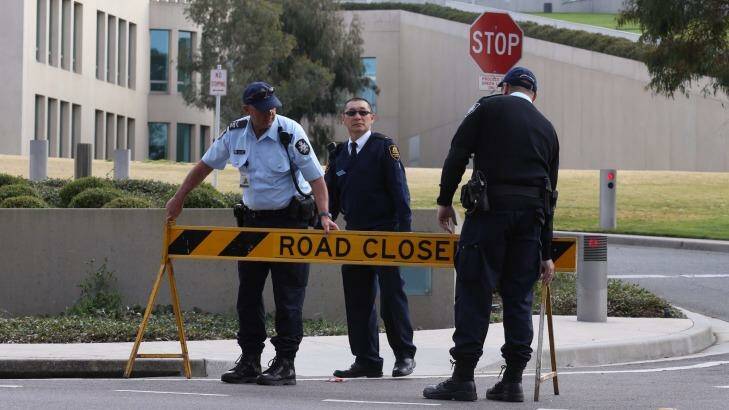 Australian Federal Police officers lockdown the ministerial entrance to Parliament House in Canberra after a security threat last September. Photo: Andrew Meares