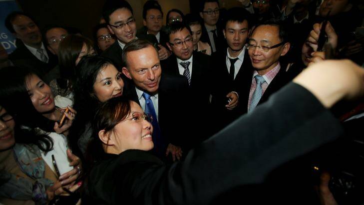 Tony Abbott poses for photos with members of the Sydney Young Chinese Business Association. Photo: Kate Geraghty