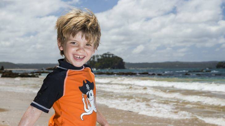 Casey Matthews-James, 4, of Buckhurst Hill, England enjoys a beautiful day at the beach in Batemans Bay. Photo: Matt Bedford