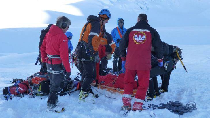 Rescuers prepare to transport the body of an Australian soldier on Aoraki Mount Cook, New Zealand. Photo: Christchurch Press