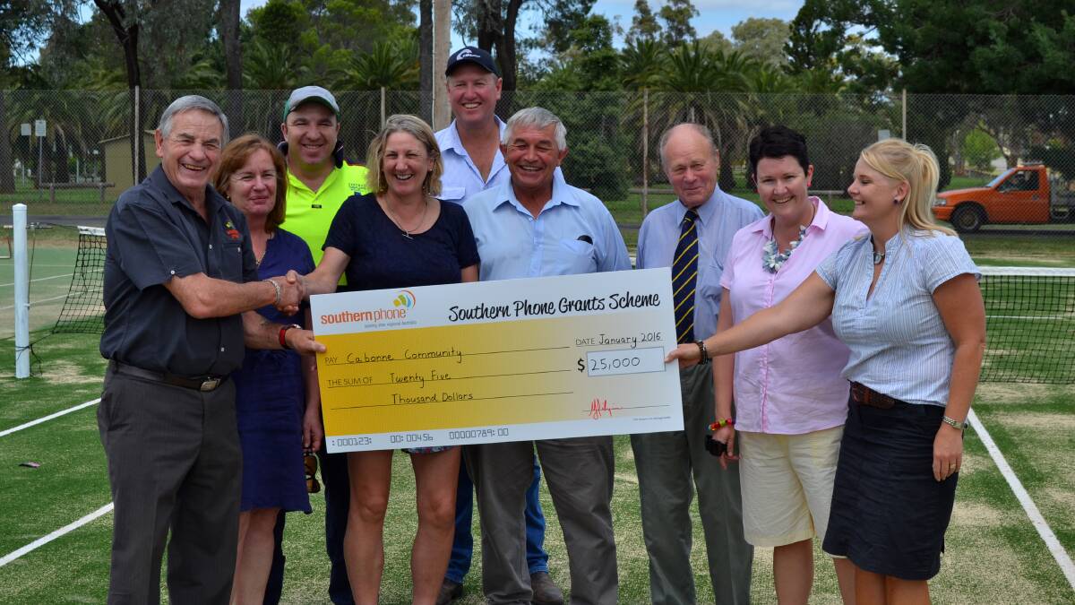 Bill Hilzinger of Southern Phones presents a cheque to Lorrae Barker, Andrew Pull, Bron Newman, Rob Atkinson, Mayor Ian Gosper, Cr Kevin Walker, Jane Atkinson and Kylie Pull.
