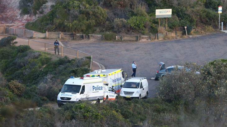 Police look for evidence after a woman's body was found at the blowhole at Snapper Point. Photo: Marina Neil