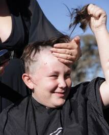 GOING, GOING, GONE: Sam Brand loses his locks for charity.