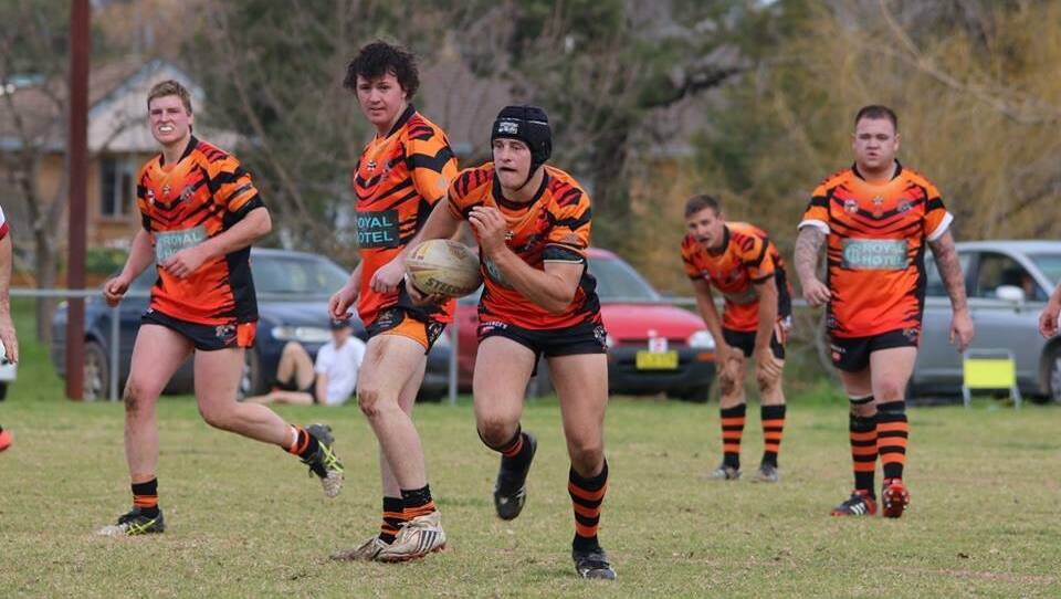 Aaron Earsman takes the ball up for the Canowindra Tigers on Saturday.