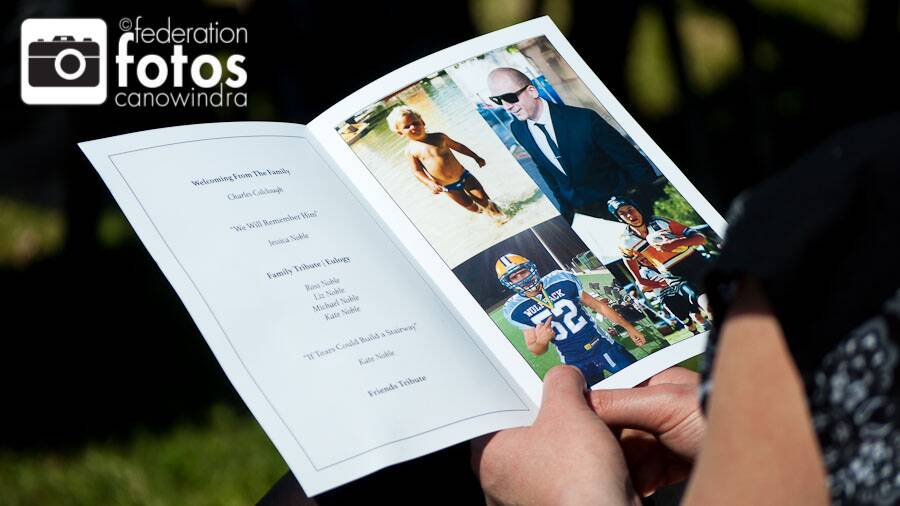 Remembering Chris.....mourners at Saturday's memorial service in Canowindra and their many memories of Chris - captured in photos for the program. Photo Federation Fotos Canowindra.
