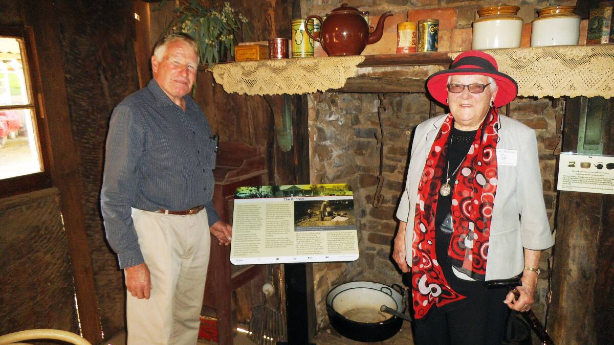 John Davidson and Dorothy Balcomb with the kitchen panel inside the hut. Photo Anne Vincent.