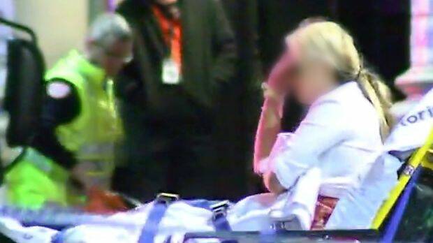 A woman attended to by paramedics near King Street nightclub Inflation. Photo: 7News