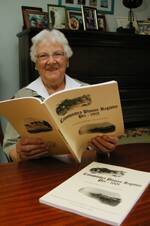 Historian Dorothy Balcomb with the pioneer registrar that is now available.