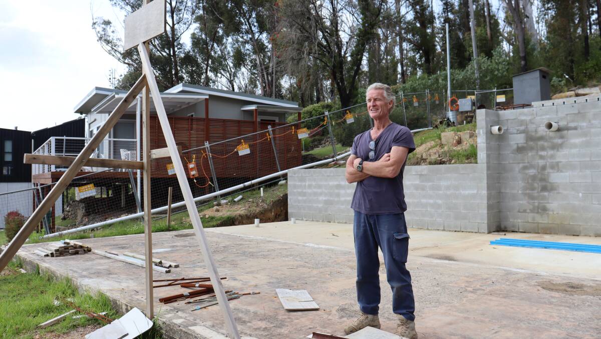 Greg Webb is in the midst of rebuilding his property at Lake Conjola on the NSW south coast using resilient materials and designs after the Black Summer bushfires destroyed his old home. Picture by Rosie Bensley