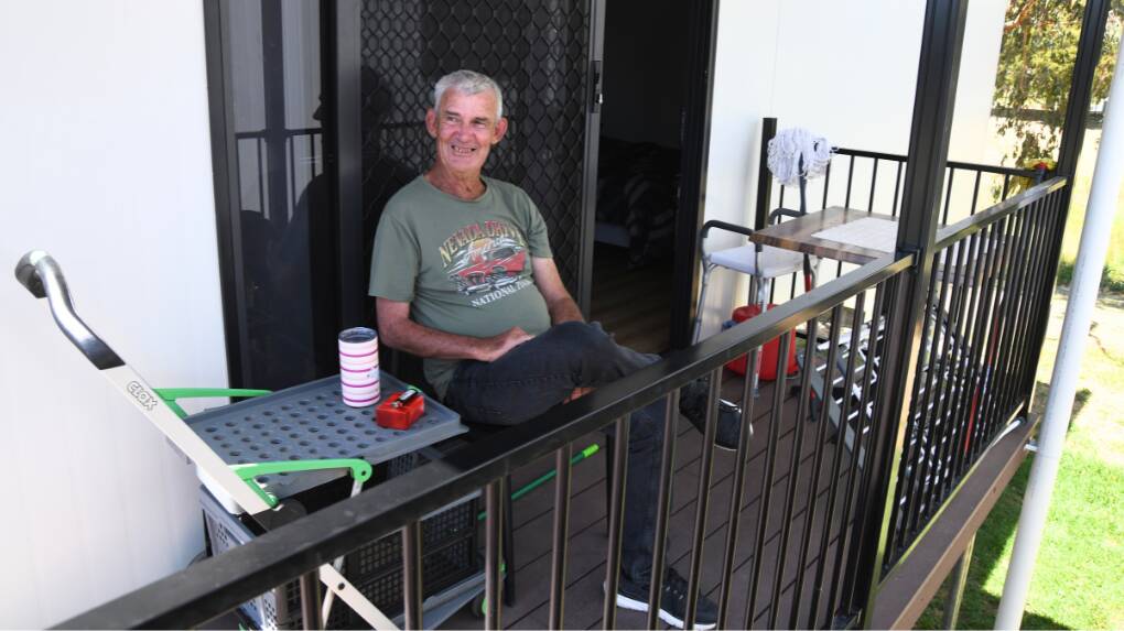 Eugowra resident Ken Woodford sits out the front of his pod home on Evelyn Street on Tuesday, October 24. Picture by Jude Keogh