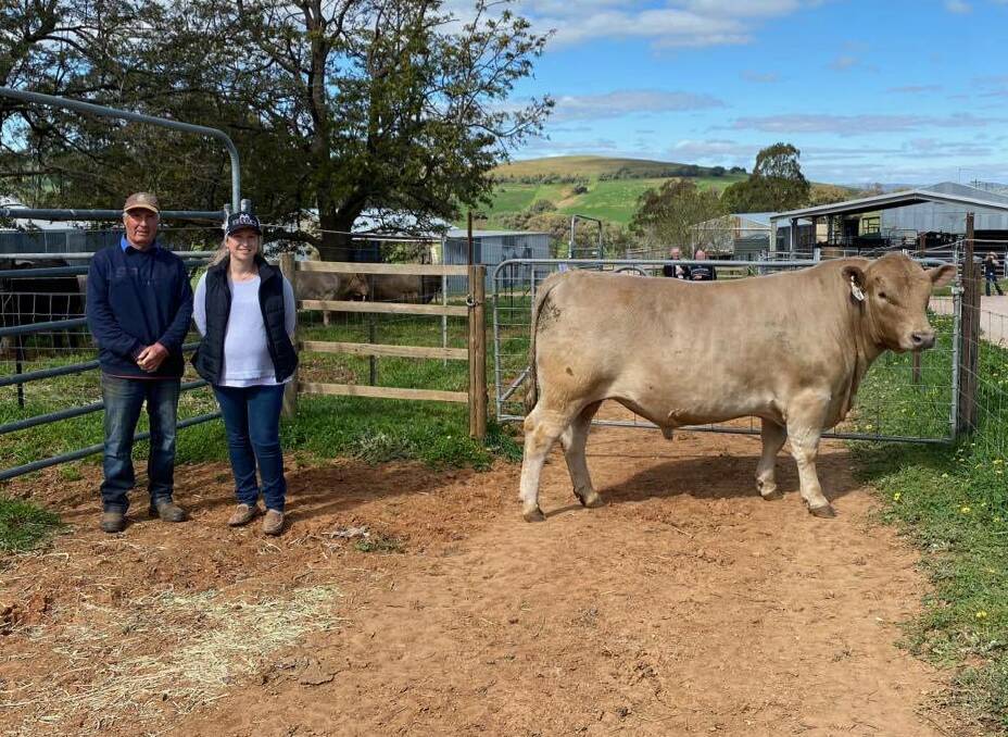 Ian Wilcox of Ayr Park, Woodstock, with Annika Whale of Double A Cattle Company, Cowra, and the $10,500 sale-topper, Ayr Park Quincey Q11. Photo: Sue Powe 