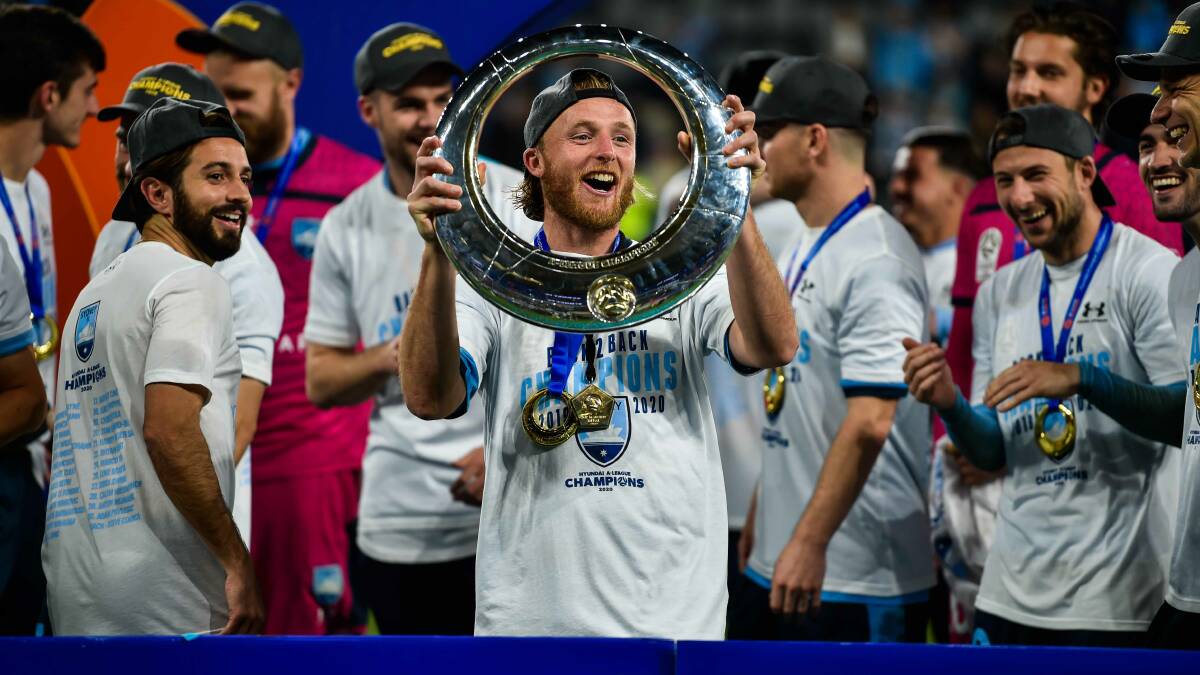 GAME ON: Rhyan Grant celebrates winning the A-League grand final with Sydney FC last season. On Saturday evening, he'll get his new campaign underway against Wellington Phoenix in Wollongong. Photo: KEITH McINNES 