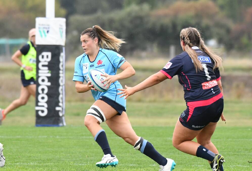 Grace Hamilton (left) in action for the NSW Waratahs when they played at Bathurst's Ashwood Park. Photo: CHRIS SEABROOK