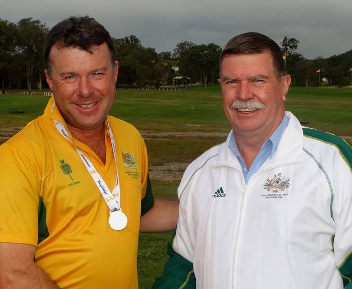 NICE WORK: Ben Emms (left) being congratulated on his Commonwealth Games nomination by Shooting Australia director Bruce Scott.