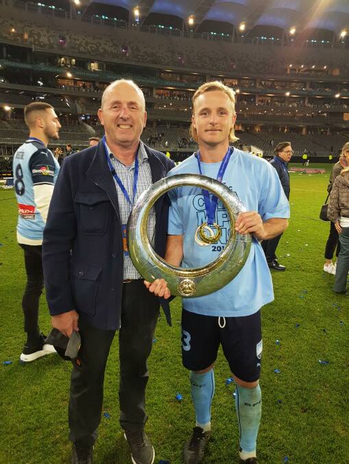 Daryl 'Rifty' Grant and Rhyan 'Busta' Grant celebrate with the A-League Bowl after Sydney FC's 4-1 penalty victory over the Perth Glory at Optus Stadium. Photo: Supplied