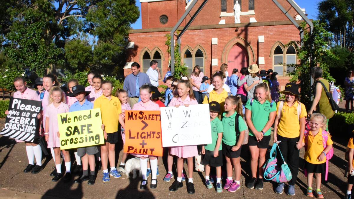 Dozens of parents, teachers and kids turned up at Friday's rally. Photo: Ben Rodin