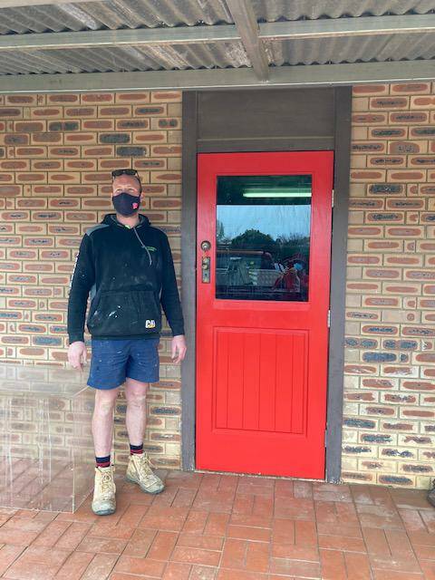 Nick Daly outside the door he installed for the Canowindra Historical Society. Photo contributed.