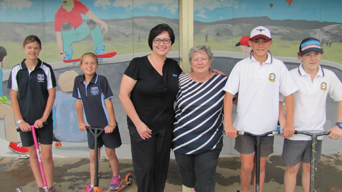 Artist Melissa Gersbach (third from left) is pictured with Cr Jenny Weaver and skate park users Izzy Brown (left), Josie Brown, Deegon Hogan and Jack Bellach following the opening of the Canowindra skate park mural.