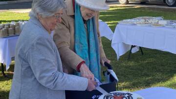Long serving UHA member Peggy Beath and former nurse Muriel Yell were given the honour of cutting the cake to make the 100th anniversary of the Canowindra Soldiers Memorial Hospital.