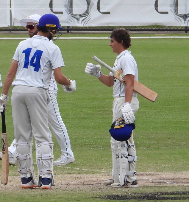 Cowra's Mikey McNamara (right) celebrating his century with an ACT team mate. Photo Cricket ACT